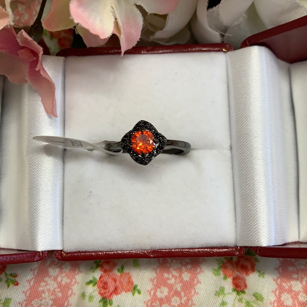 Size 8 black colored ring with orange crystal NWT